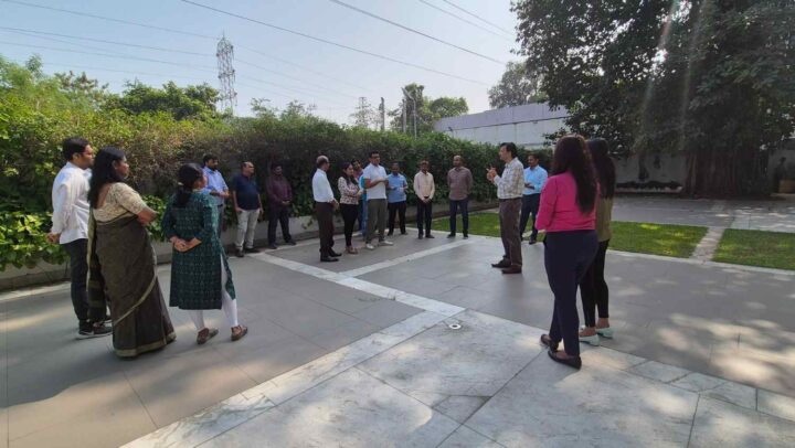 Employees participating in a corporate leadership and team engagement session facilitated by DimenZion3 outdoors.