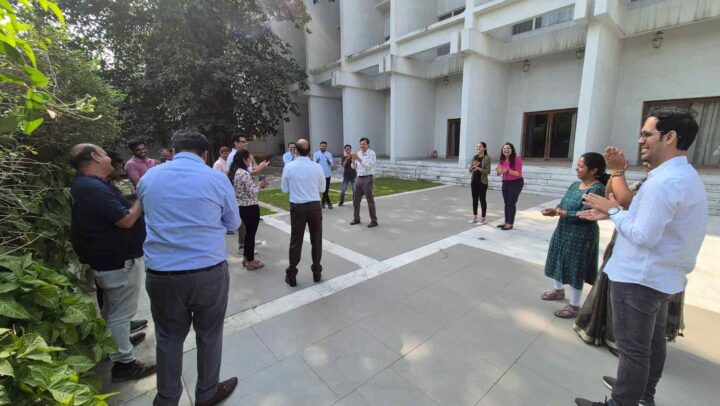 Employees participating in an interactive corporate team building and leadership workshop facilitated by DimenZion3.