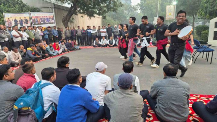 Employees participating in a corporate team engagement and cultural activity during a workplace leadership program by DimenZion3.