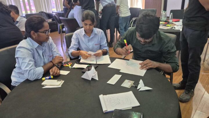 Team collaborating on a creative workshop exercise