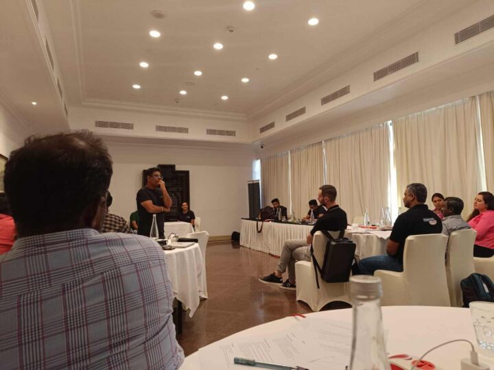 DimenZion3 leadership workshop with participants seated around discussion tables