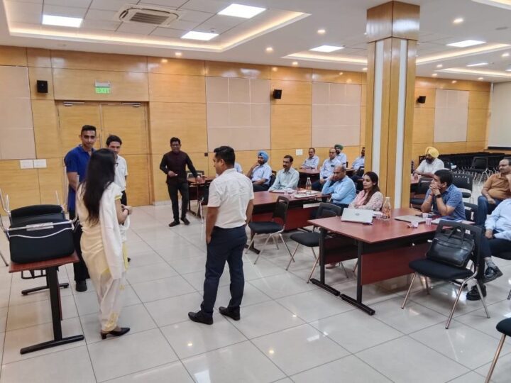 DimenZion3 team participating in a corporate workshop group activity