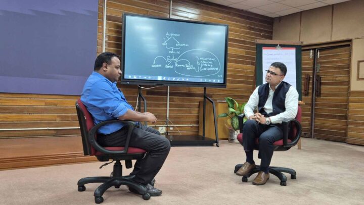 Two professionals engaged in an executive coaching and leadership dialogue facilitated by DimenZion3.