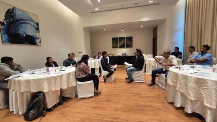 Professionals participating in an interactive leadership training group activity during a DimenZion3 workshop.