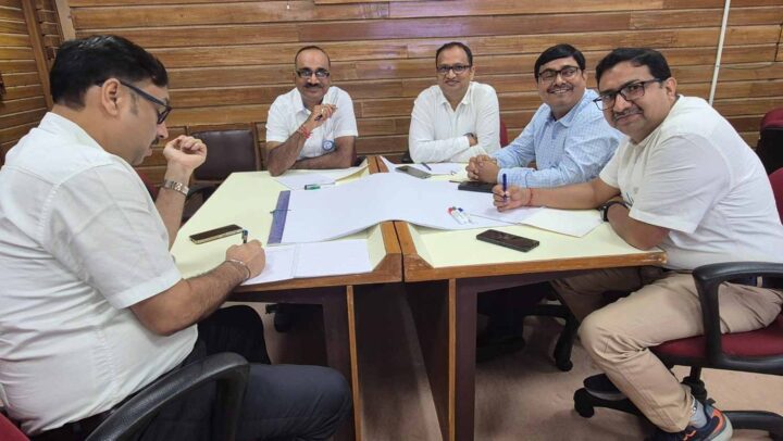 Professionals collaborating during a leadership strategy and team planning session facilitated by DimenZion3.