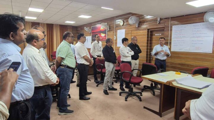 Leaders participating in an organizational development and problem-solving discussion during a DimenZion3 workshop.
