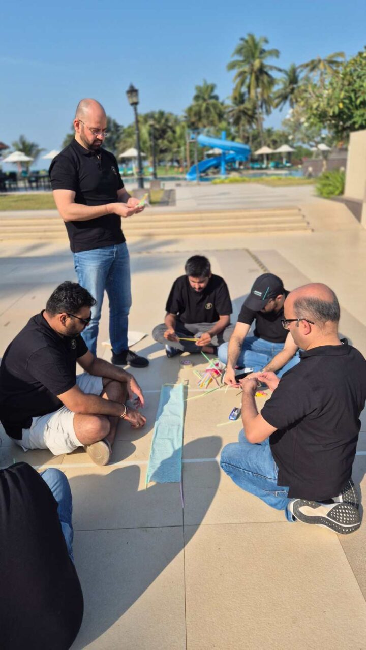 Participants working together during an outdoor leadership and team challenge organized by DimenZion3.