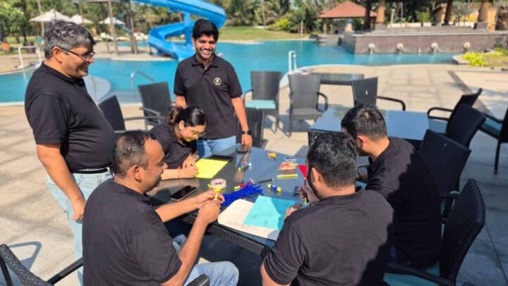 Team members collaborating during a poolside team-building activity