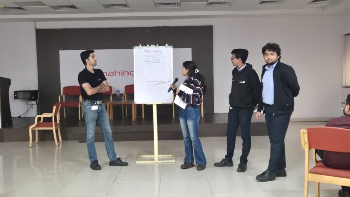 Team presenting ideas during an interactive workshop session
